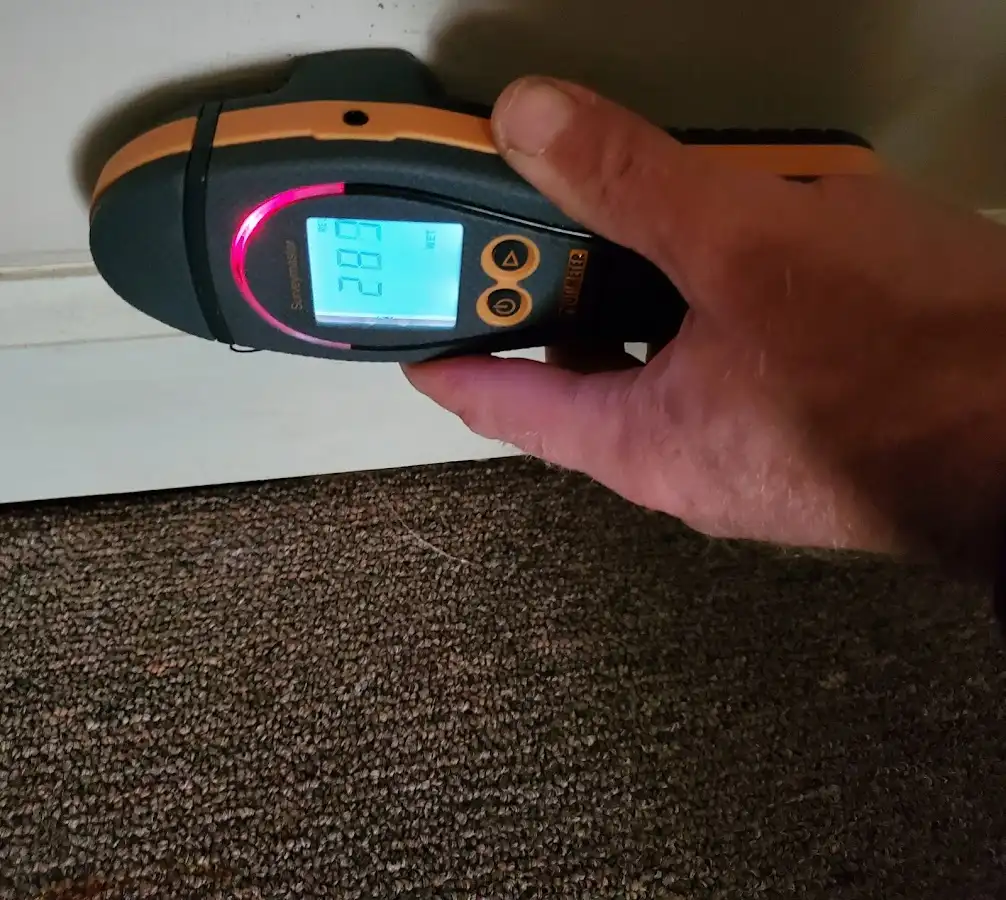 Moisture detection at baseboard during Storm Damage Restoration in Fremont